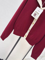 Color-block knit cardigan featuring a nautical-style collar