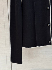 Color-block knit cardigan featuring a nautical-style collar