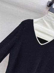 Black-and-white color-block V-neck knit top