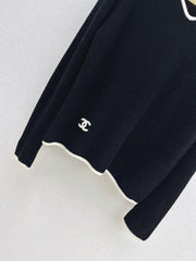 Black-and-white color-block V-neck knit top