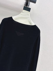 Black-and-white color-block V-neck knit top