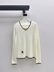 Black-and-white color-block V-neck knit top