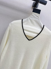 Black-and-white color-block V-neck knit top