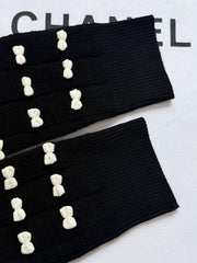 Knot-patterned long-sleeved knit sweater
