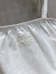 Off-white lace-trimmed vacation-style camisole
