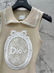 Open-knit vest with a Peter Pan collar