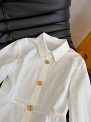 Waist-cinching shirt with large gold button accents