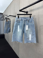 Ripped sticker denim shorts