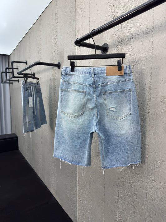 Ripped sticker denim shorts