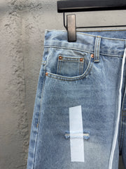 Ripped sticker denim shorts