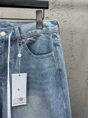 Ripped sticker denim shorts