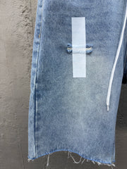 Ripped sticker denim shorts