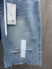 Ripped sticker denim shorts