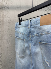 Ripped sticker denim shorts