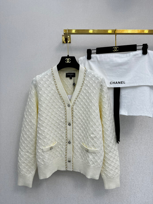 Simple knitted cardigan with chain detail