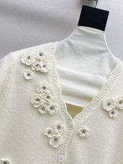 V-neck sweater with 3D floral embellishments