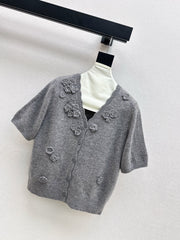 V-neck sweater with 3D floral embellishments