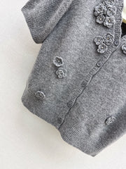 V-neck sweater with 3D floral embellishments