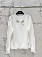 Bowknot hollow jacquard crew neck knitted sweater