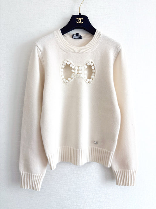 Openwork bow sweater