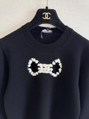 Openwork bow sweater