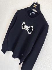 Openwork bow sweater