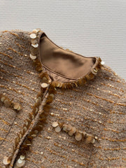 Gold sequined tweed Chanel-style jacket