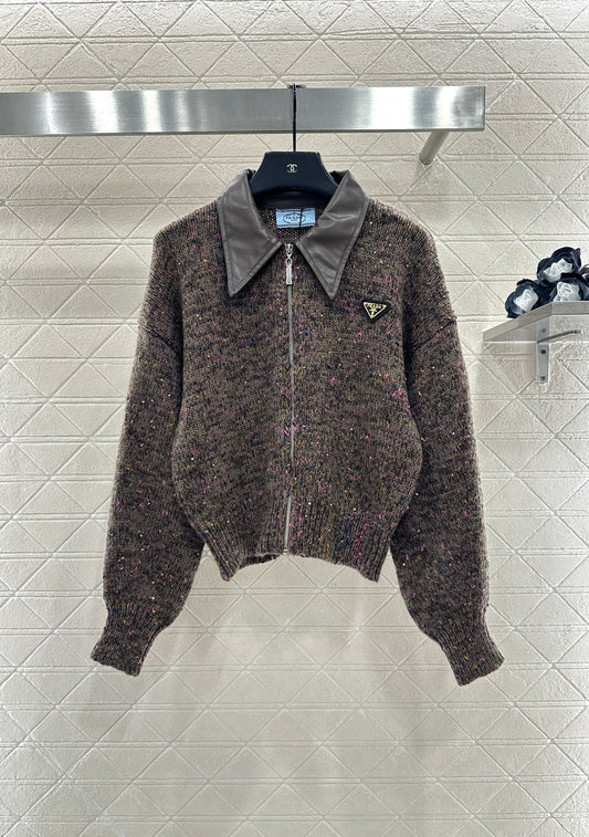 Leather-trimmed lapel knit zip-up jacket.