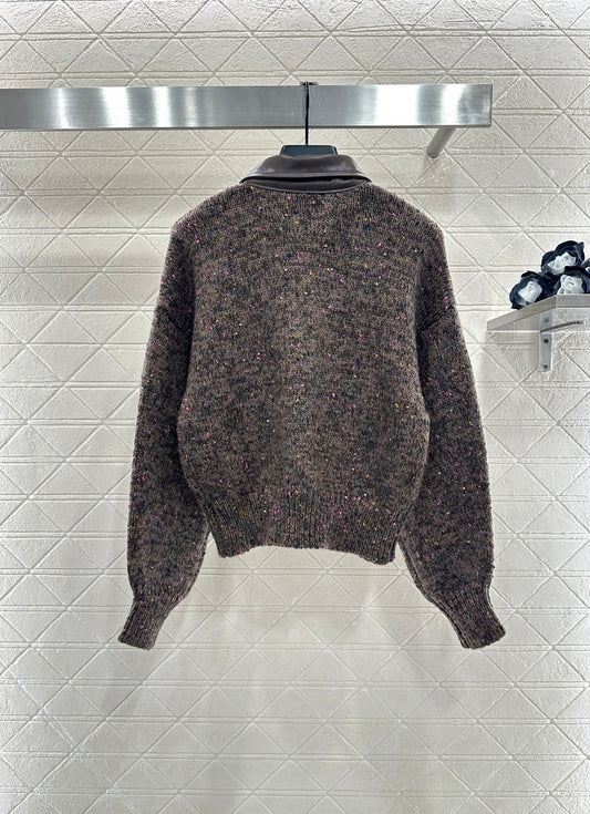 Leather-trimmed lapel knit zip-up jacket.