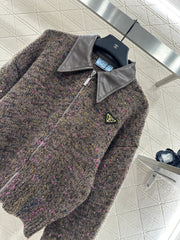 Leather-trimmed lapel knit zip-up jacket.