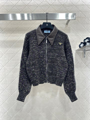 Leather-trimmed lapel knit zip-up jacket.