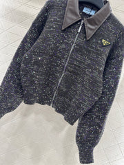 Leather-trimmed lapel knit zip-up jacket.