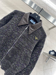 Leather-trimmed lapel knit zip-up jacket.