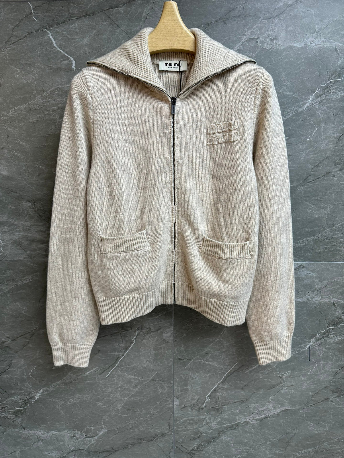 Oatmeal-colored knit cardigan