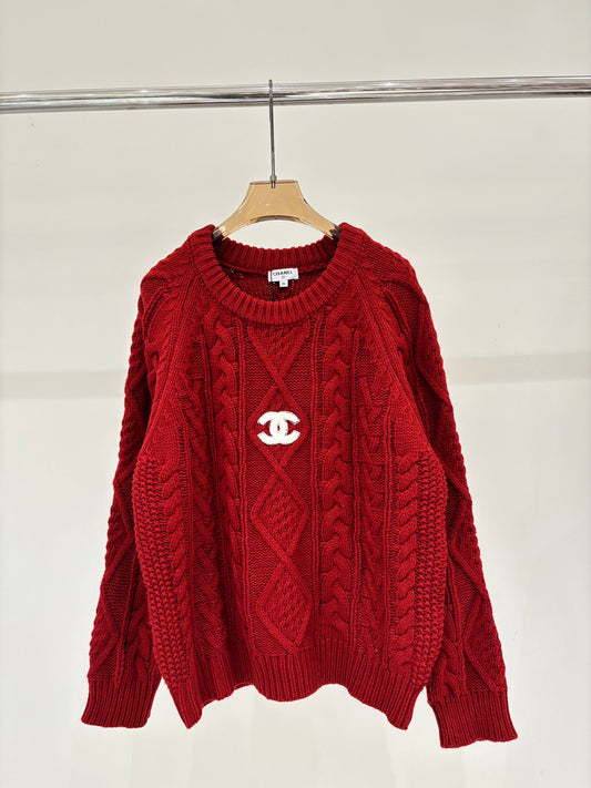 Oversized sweater with diamond cable knit pattern