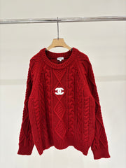 Oversized sweater with diamond cable knit pattern