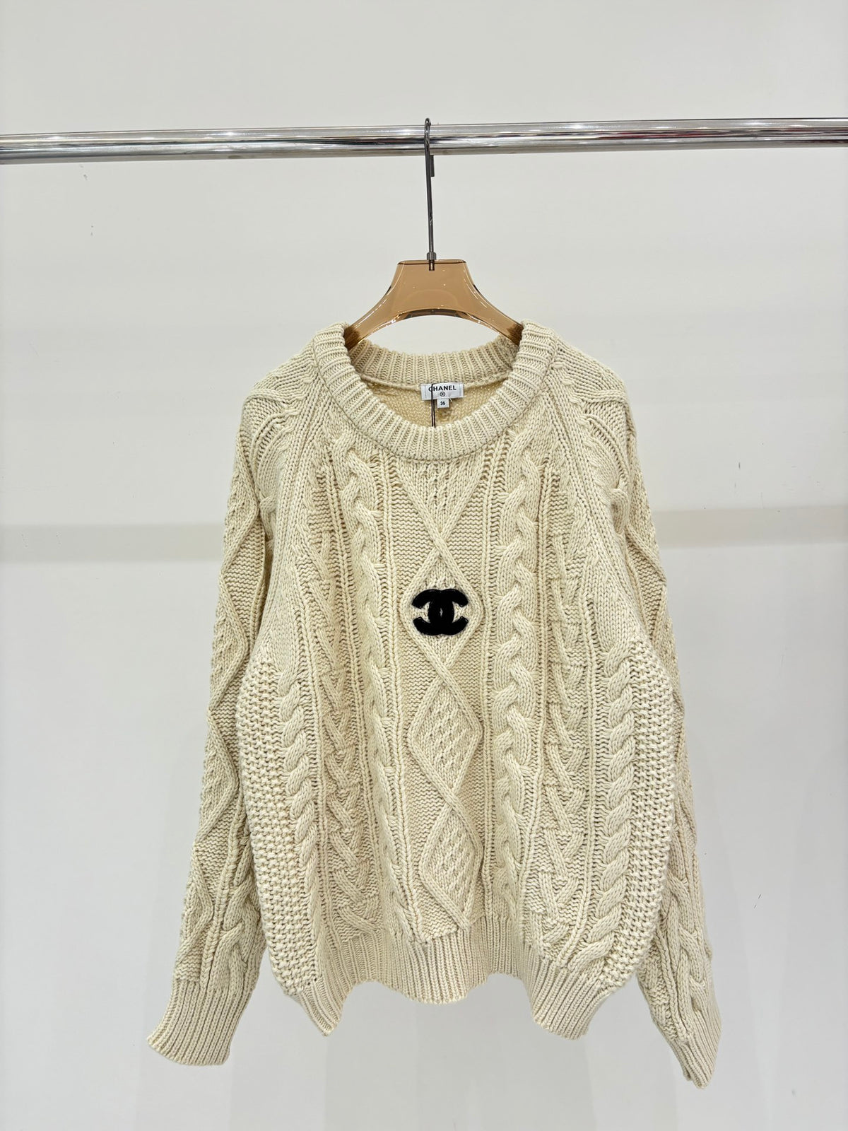 Oversized sweater with diamond cable knit pattern