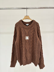 Oversized sweater with diamond cable knit pattern