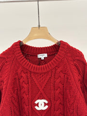 Oversized sweater with diamond cable knit pattern