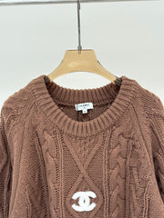 Oversized sweater with diamond cable knit pattern
