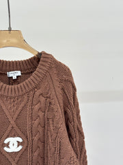 Oversized sweater with diamond cable knit pattern