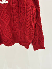 Oversized sweater with diamond cable knit pattern