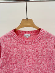 Sweater with small pockets at the hem