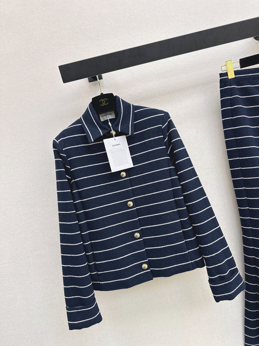 A navy blue coat with beige pinstripes and a lapel collar