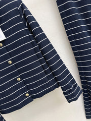 A navy blue coat with beige pinstripes and a lapel collar
