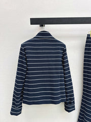 A navy blue coat with beige pinstripes and a lapel collar