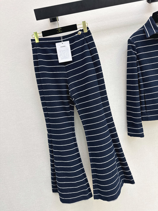 Navy blue flared trousers with beige pinstripes