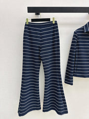 Navy blue flared trousers with beige pinstripes