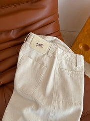 Jeans with leather patch detailing