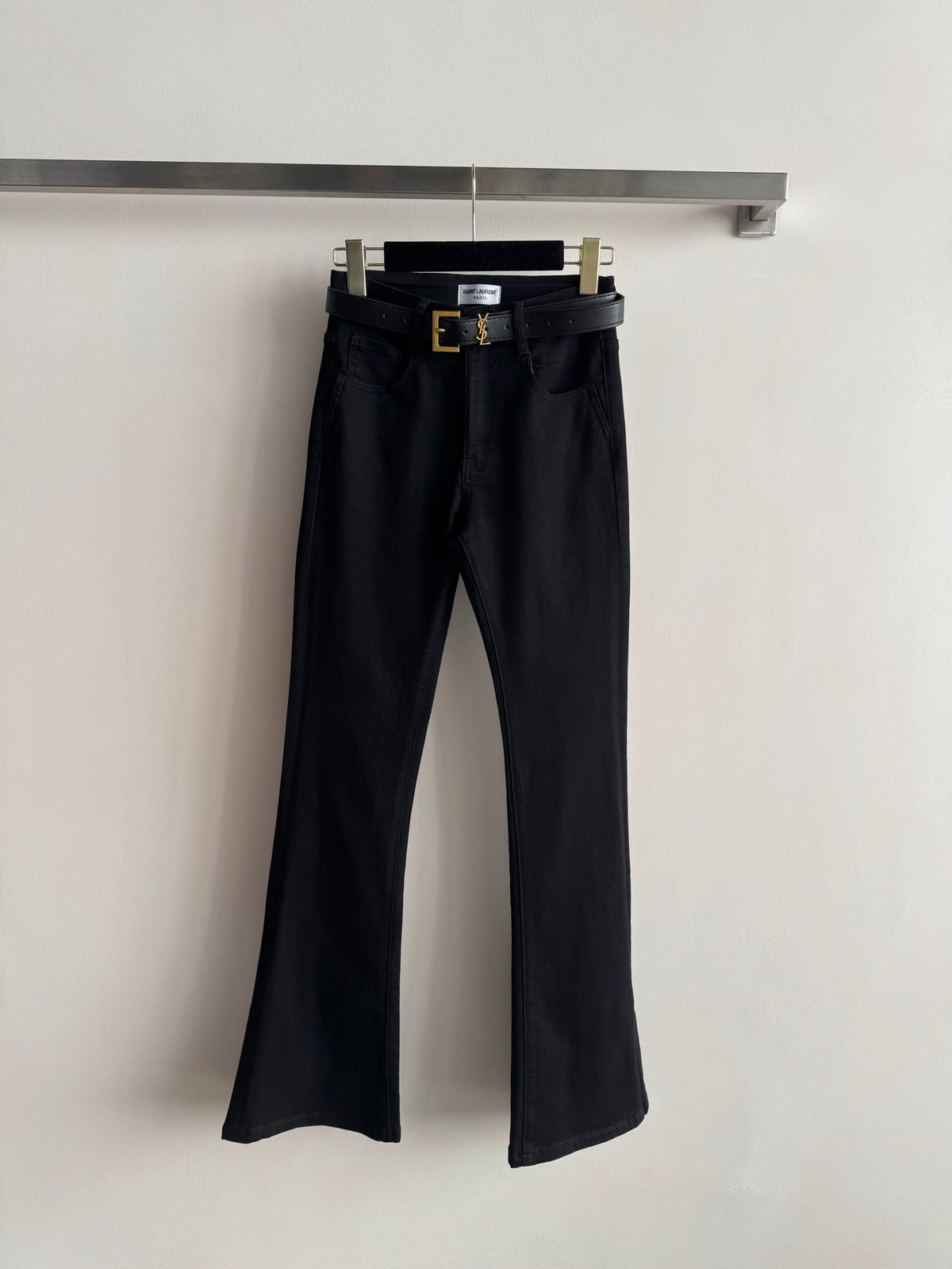 High-waisted embroidered flared pants.